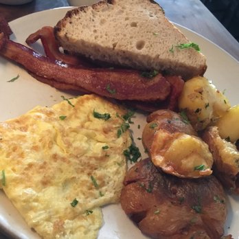 Outerlands - (Overcooked) scrambled eggs, decent potatoes and world-class bacon and homemade toast. - New American Near Me - San Francisco, California Outerlands - (Overcooked) scrambled eggs, decent potatoes and world-class bacon and homemade toast. - New American Near Me - San Francisco, California
