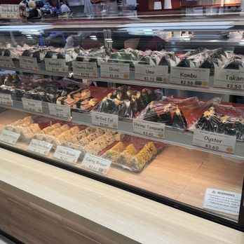 Omusubi Gonbei - Display case of all the different types of musubis. - Japanese Near Me - Cypress, California Omusubi Gonbei - Display case of all the different types of musubis. - Japanese Near Me - Cypress, California