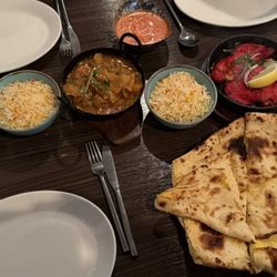Ayr India - (From left to right) Chicken Chasni, Chicken Karachi, pilau rice, Ayr India Special Chicken Tikka, and peshwari naan.