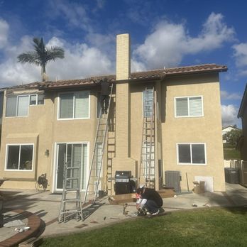 THD Rain Gutters - a man on a ladder in front of a house - General Contractors Near Me - Compton, California