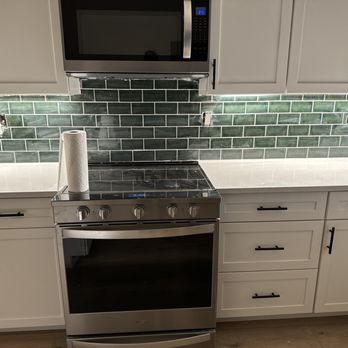 CAMC Construction - a clean kitchen with stainless steel appliances - General Contractors Near Me