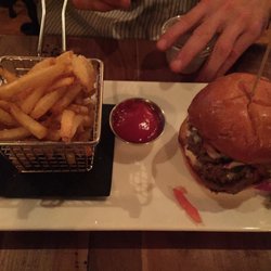 Owl & Elm - Burger with fries in a basket