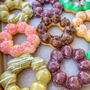 Friendly Donuts - Mochi Donuts. Flavors: Chocolate Chip, Matcha, White Chocolate Guava, Pots of Gold, Lavender, Ube, Strawberry Lemonade (IG: @foodwithbros) - Donuts Near Me - Orange, California