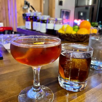 Fremont Mischief Distillery - two cocktails on a bar - Distilleries Near Me - Seattle, Washington