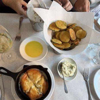 KAVA neo-taverna - Zucchini chips w/ tzatziki, flaming cheese (special) - Greek Near Me - Boston, Massachusetts KAVA neo-taverna - Zucchini chips w/ tzatziki, flaming cheese (special) - Greek Near Me - Boston, Massachusetts
