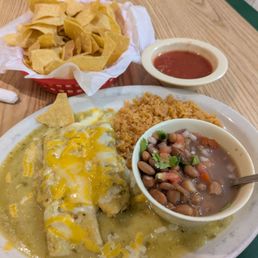 Pork tamale and a cheese enchilada with verde sauce. Rice and charro beans.