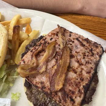 La Parrilla - What is this?!?! He is so brave for even attempting to eat this. Tex Mex Burger - Mexican Near Me - San Antonio, Texas