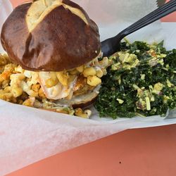 Mac n cheese chicken sandwich with a side of kale salad.