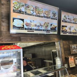 Perla de Oriente Kitchen - The entire waiting/ ordering area, plus the top menus. Kitchen behind