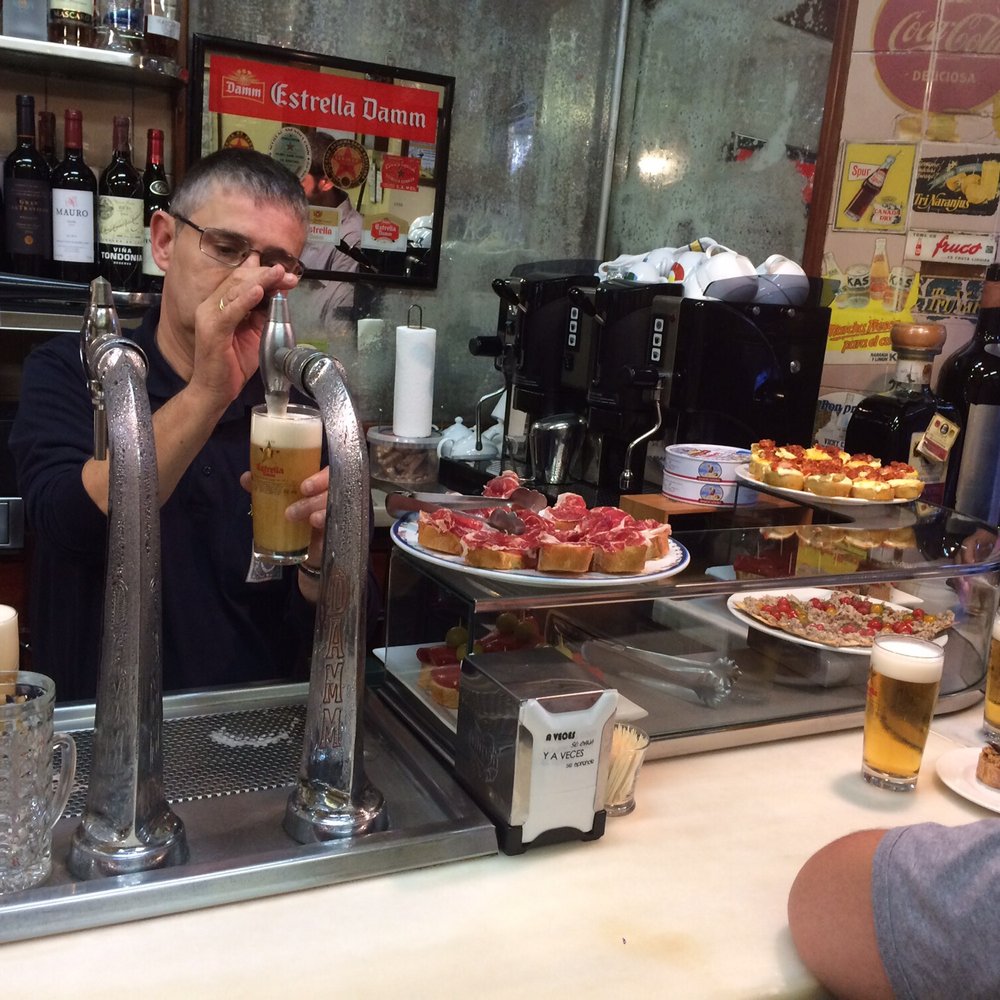 El Xampanyet - Countertop in action a few minutes after opening up for the day. - Tapas Bars Near Me - Barcelona, B