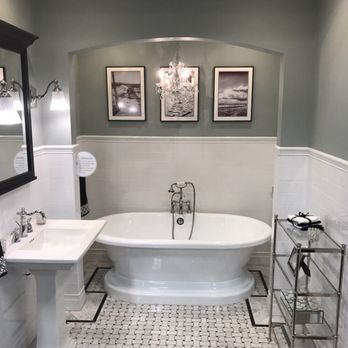 The Tile Shop - a bathtub and sink in a bathroom - Flooring Near Me - Warwick, Rhode Island The Tile Shop - a bathtub and sink in a bathroom - Flooring Near Me - Warwick, Rhode Island