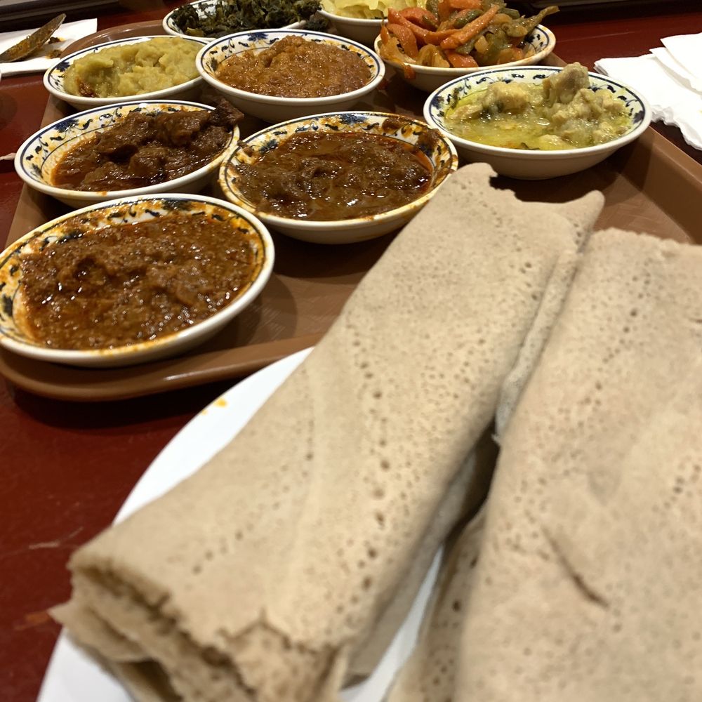 Manna Bistro - The meat and chicken stews are the four dishes, behind the perfect injera bread with just the right texture and taste! - Ethiopian Near Me - Centreville, Virginia Manna Bistro - The meat and chicken stews are the four dishes, behind the perfect injera bread with just the right texture and taste! - Ethiopian Near Me - Centreville, Virginia