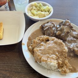 Smothered Oxtails Is late with cabbage and cornbread Smothered Oxtails Is late with cabbage and cornbread