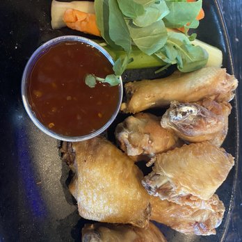 Tavern in the Square - Bang Bang chicken wings.   Sauce on the side - New American Near Me - Shrewsbury, Massachusetts