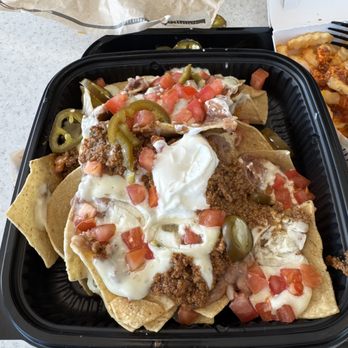 Del Taco - 4/5 $6.99 Queso loaded nachos...I prefer cheddar cheese. This was a large dish with a ton of fixings. - Mexican Near Me - Port St. Lucie, Florida Del Taco - 4/5 $6.99 Queso loaded nachos...I prefer cheddar cheese. This was a large dish with a ton of fixings. - Mexican Near Me - Port St. Lucie, Florida