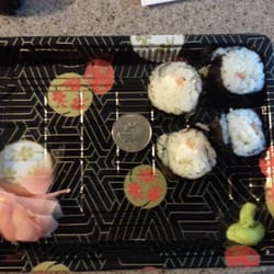 Nagoya - The quarter is there for a size reference. This is a philadelphia roll. Good luck finding the fish!