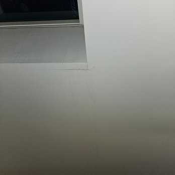 Skylight Pros by Blue Bell - Cracked drywall, water stains running down front right side ceiling from front of skylight - Windows Installation Near Me - Bala Cynwyd, Pennsylvania