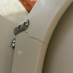 Cracked toilet seat was one of the indications of lack of maintenance