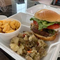 The alarm burger with side of home style potatoes and Mac and cheese.