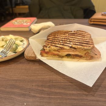 Nuts and Delights - Turkey Panini with side plate of olives & avocado. - Coffee & Tea Near Me - Montclair, New Jersey