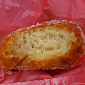 A Leonard's Bakery - Close up of malasada. - Desserts Near Me - Waipahu, Hawaii A Leonard's Bakery - Close up of malasada. - Desserts Near Me - Waipahu, Hawaii