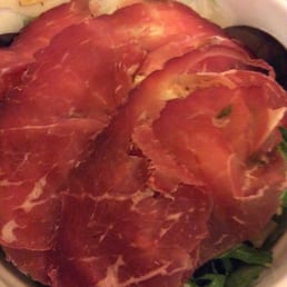Salad with artichoke, parmesan, and cured ham Salad with artichoke, parmesan, and cured ham