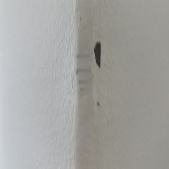 Tompkins Flooring Irvine - a white wall with a hole in it - Flooring Near Me - Irvine, California