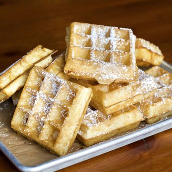 Little Skillet - a plate of waffles with powdered sugar on top - Food Delivery Services Near Me - Oakland, California Little Skillet - a plate of waffles with powdered sugar on top - Food Delivery Services Near Me - Oakland, California