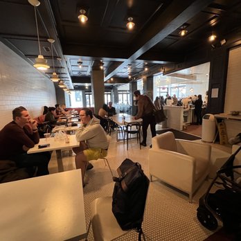Atomic Coffee - people sitting at tables in a coffee shop - Coffee & Tea Near Me - Royal Oak, Michigan