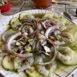 Auguachiles especial dish. Marinated shrimp in lime juice, octopus, onions, and a very spicy serrano sauce