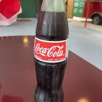 Julis Mexican Restaurant - Coca Cola Mexicana! it has cane sugar not corn syrup. Not as painfully sweet as Americano Coke - Mexican Near Me - Oldsmar, Florida Julis Mexican Restaurant - Coca Cola Mexicana! it has cane sugar not corn syrup. Not as painfully sweet as Americano Coke - Mexican Near Me - Oldsmar, Florida