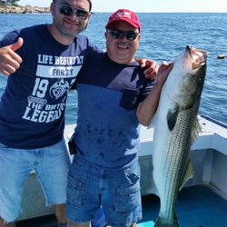 Striperking charters - 40" 30lb Striped Bass by first time salty.