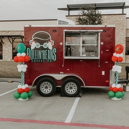 a food truck with balloons