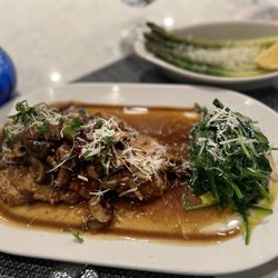 Azzurra Cucina Italiana - Chicken marsala, gluten-free version. So no flour on the chicken or in the sauce. Side of spinach and asparagus
