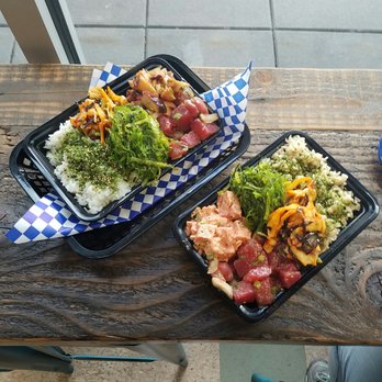 Seattle Fish Guys - My poke bowl and my cousin's: shoyu tuna and Tako for me with seaweed salad, calamari, and furikake. Other bowl has spicy and shoyu tuna. - Seafood Markets Near Me - Seattle, Washington
