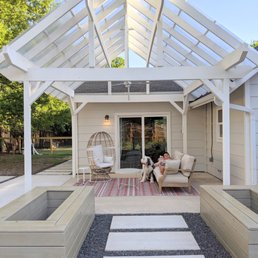 New pergola, framed out tree boxes, hardscaping, patio extension