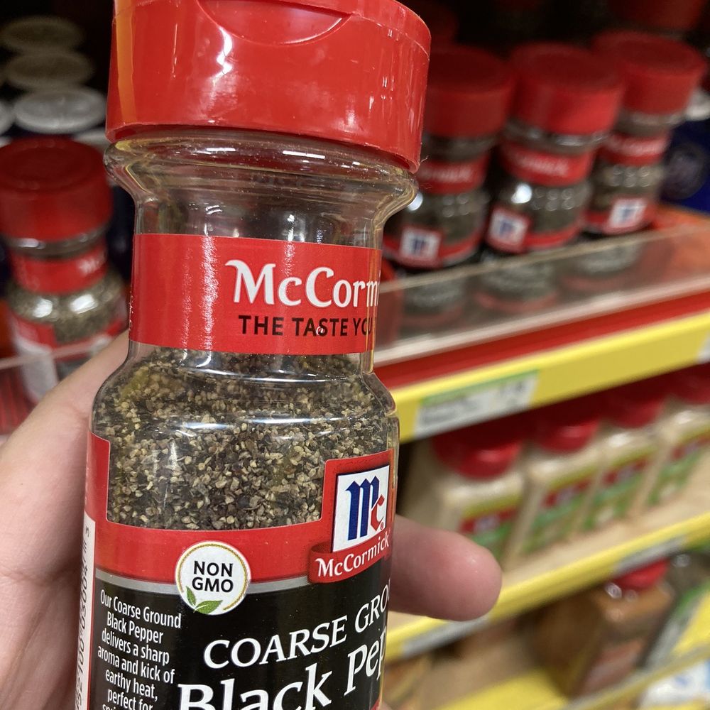 Food 4 Less - a hand holding a jar of black pepper - Grocery Near Me - Manteca, California Food 4 Less - a hand holding a jar of black pepper - Grocery Near Me - Manteca, California