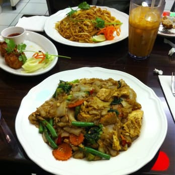 Chok Dee Thai Kitchen - Clockwise from top: Pad Thai, Thai Iced Tea, Pad Kee Maow, Golden Fritters - Thai Near Me - Norwood, New Jersey Chok Dee Thai Kitchen - Clockwise from top: Pad Thai, Thai Iced Tea, Pad Kee Maow, Golden Fritters - Thai Near Me - Norwood, New Jersey