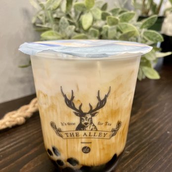 The Alley - a cup of iced coffee on a table - Bubble Tea Near Me - Vancouver, British Columbia The Alley - a cup of iced coffee on a table - Bubble Tea Near Me - Vancouver, British Columbia