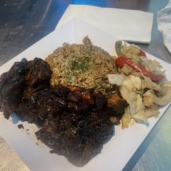 Cove 1606 Bar & Grille - Oxtails, jasmine rice & cabbage