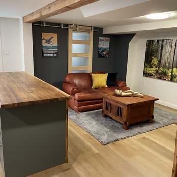 Stoked Homes - a living room and kitchen - General Contractors Near Me