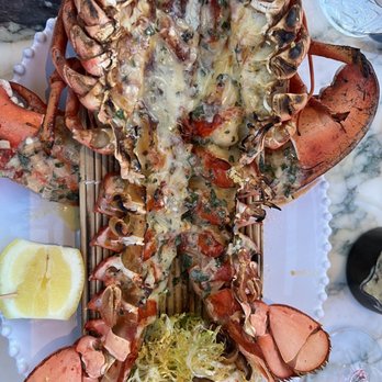 Giselle Miami - Flamed lobster - Mediterranean Near Me - Miami, Florida Giselle Miami - Flamed lobster - Mediterranean Near Me - Miami, Florida
