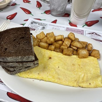 Meg's Grill - American cheese omelette with home fries and pumpernickel toast - Breakfast & Brunch Near Me - Lavallette, New Jersey Meg's Grill - American cheese omelette with home fries and pumpernickel toast - Breakfast & Brunch Near Me - Lavallette, New Jersey
