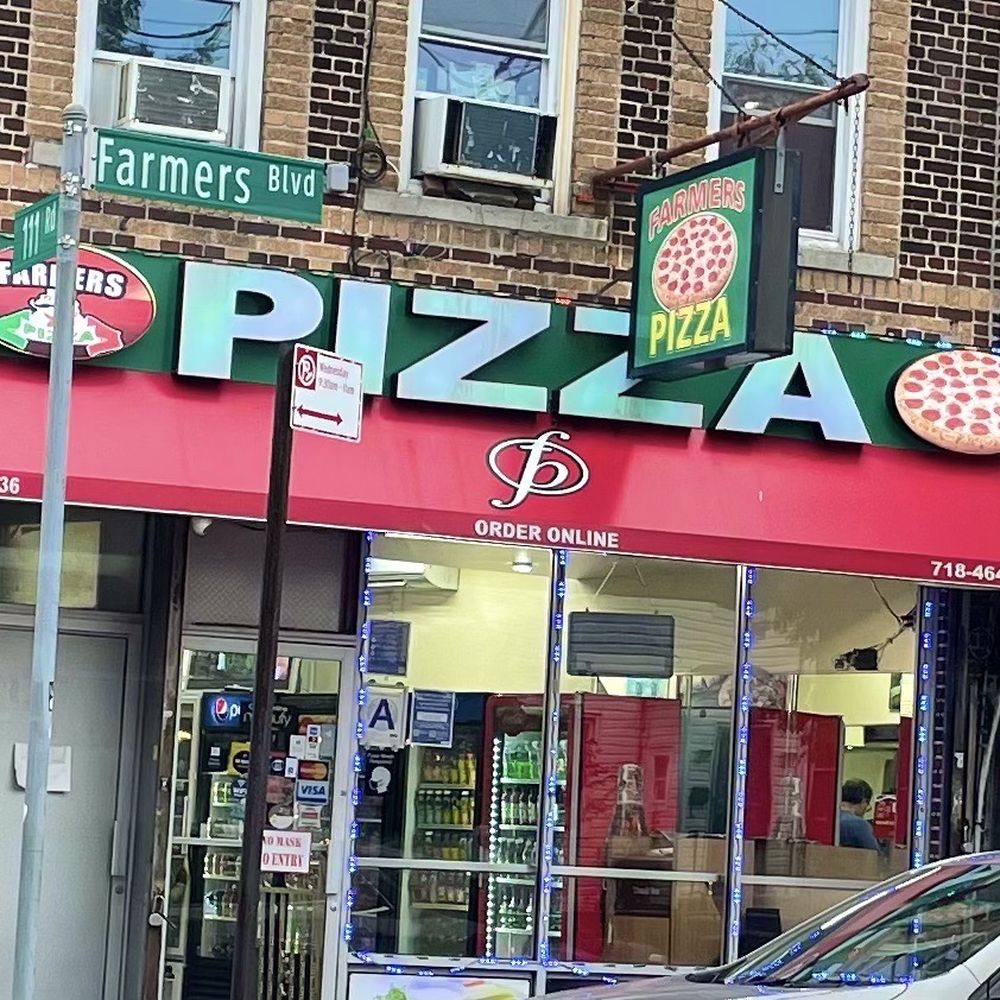 a car parked in front of a pizza shop