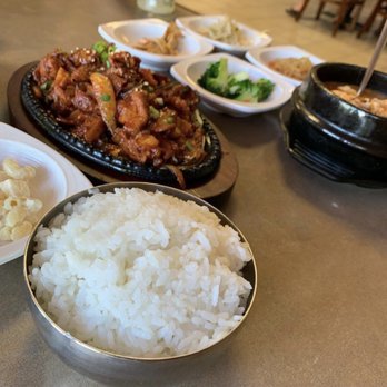 Hansang Tofu - Spicy pork and pork tofu soup with a side of rice and a variety of side dishes - Korean Near Me - Milpitas, California