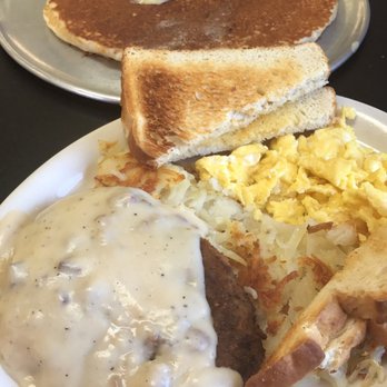 Kay's Kafe - Chicken fried steak with scrambled eggs. blueberry pancakes in the background. - Cafes Near Me - Phoenix, Arizona Kay's Kafe - Chicken fried steak with scrambled eggs. blueberry pancakes in the background. - Cafes Near Me - Phoenix, Arizona