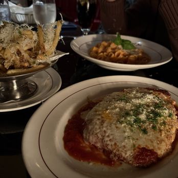 Original Joe's - Veal Parmigiana with Spicy Rigatoni in the background - Italian Near Me - San Francisco, California Original Joe's - Veal Parmigiana with Spicy Rigatoni in the background - Italian Near Me - San Francisco, California