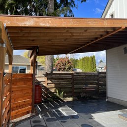 Carport with metal roof, pavers, rain barrel. Carport with metal roof, pavers, rain barrel.