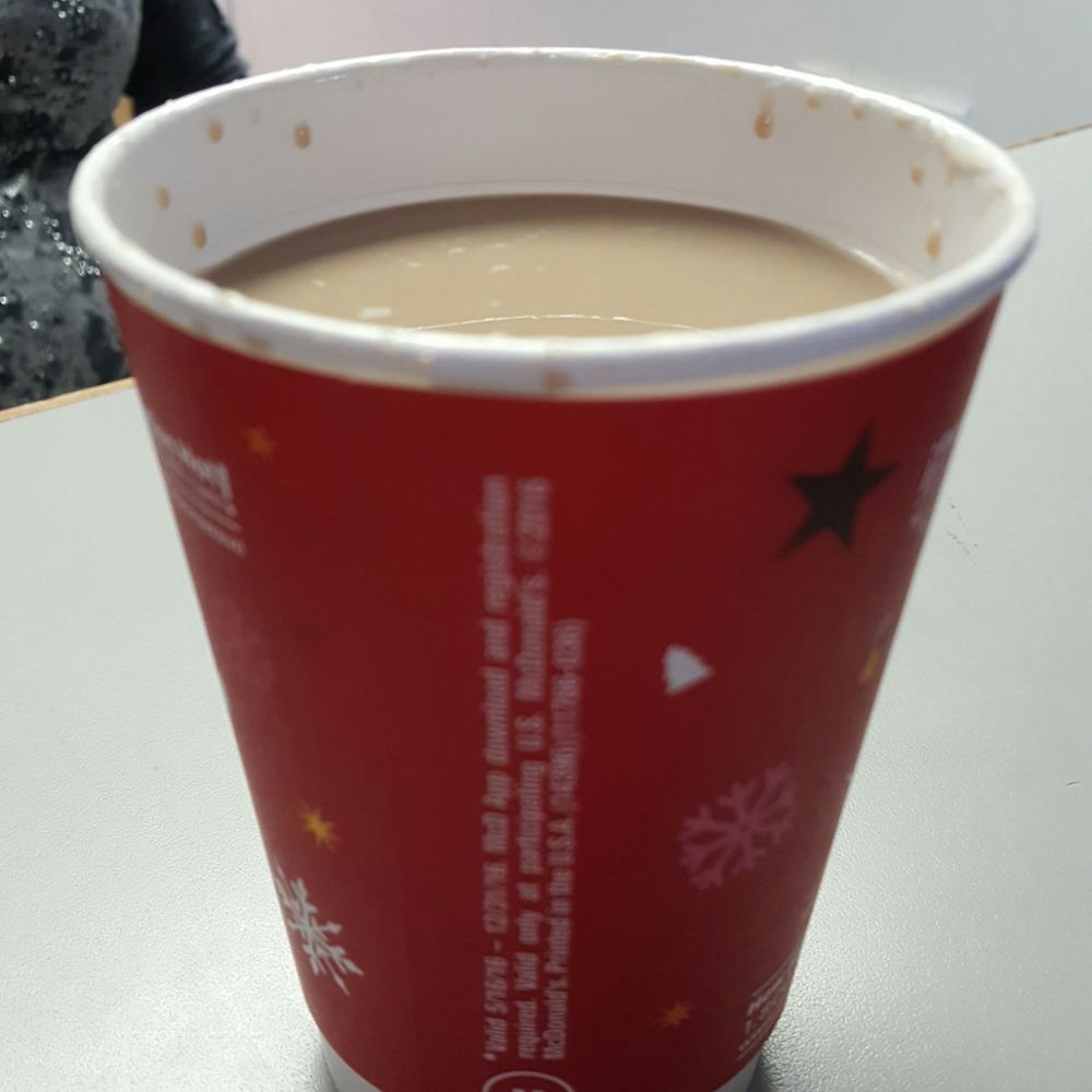 a cup of coffee on a table a cup of coffee on a table