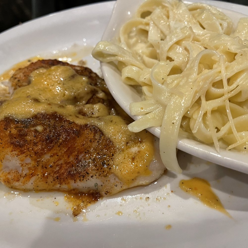 Lucky's Steak House - Crab-stuffed Grouper with fettuccine Alfredo - Steakhouses Near Me - Clio, Michigan